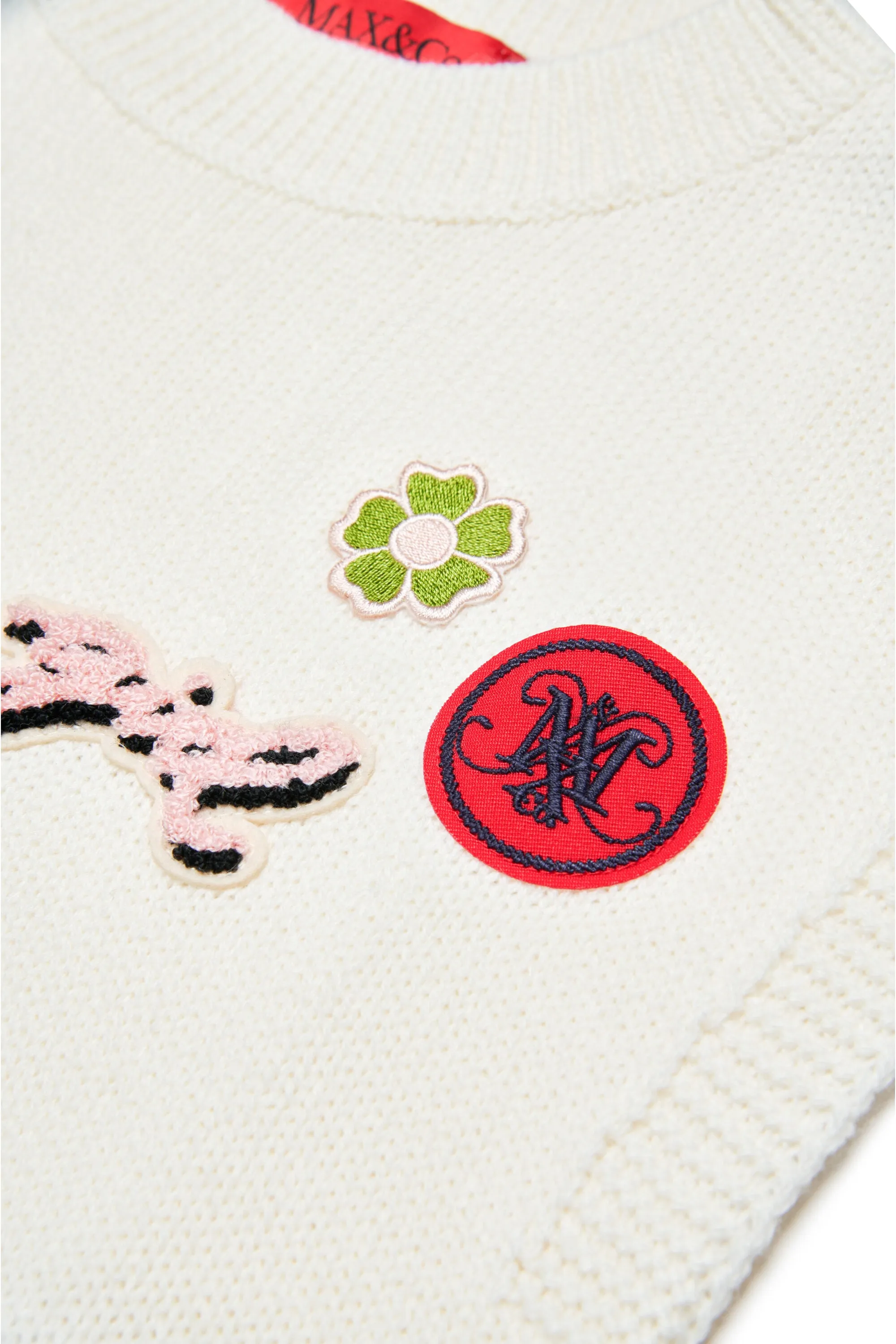Knitted vest with patch