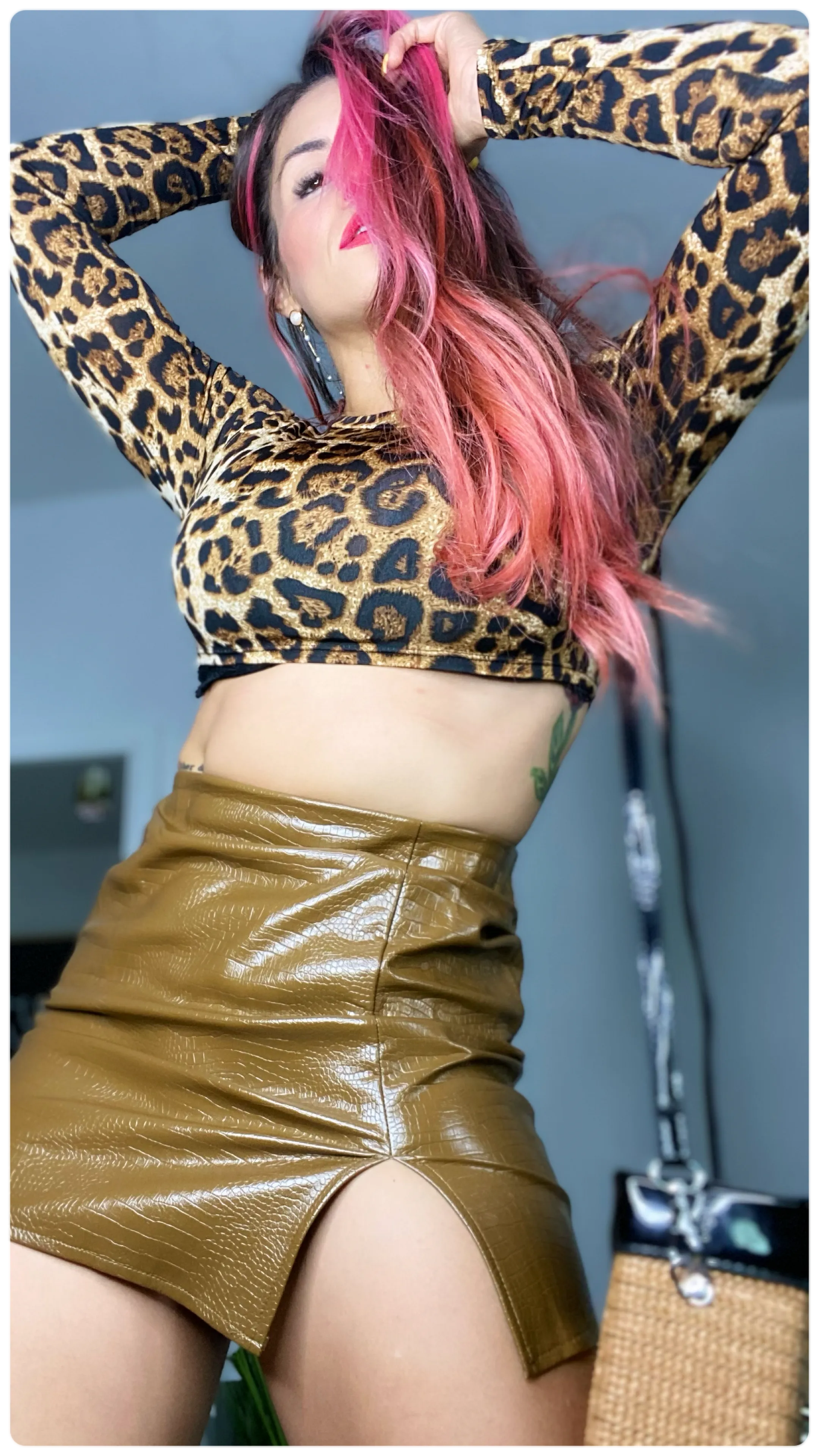 Snake in leather mini skirt